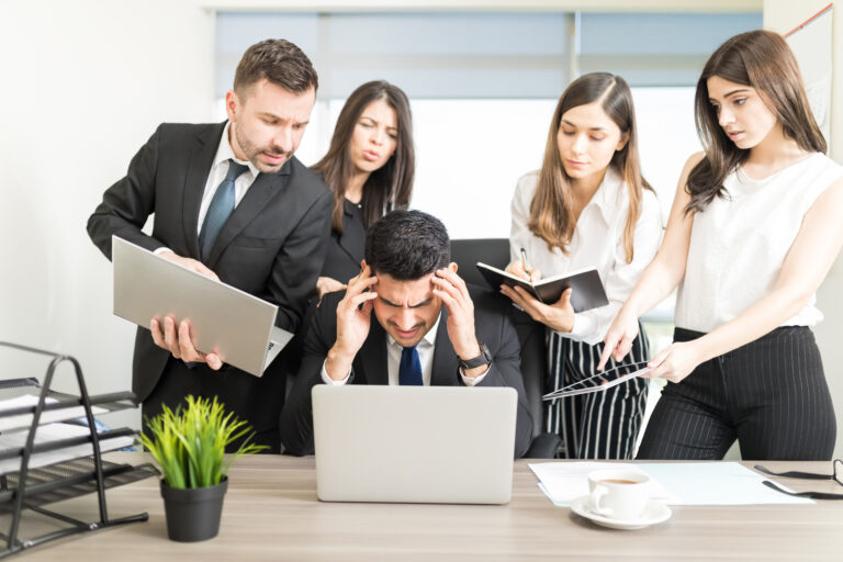 male business executive missing deadline at desk