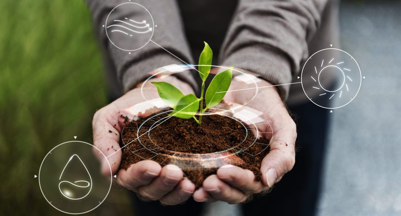 smart agriculture iot with hand planting tree background